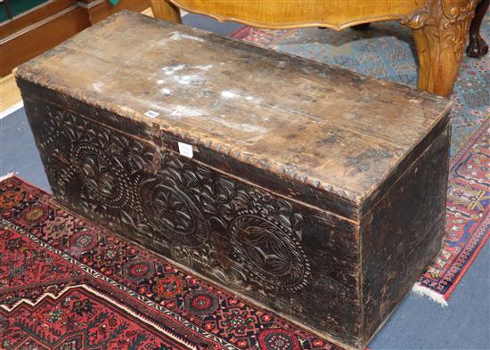 A 17th century Scandinavian chest, the front chip carved with rosettes W.104cm